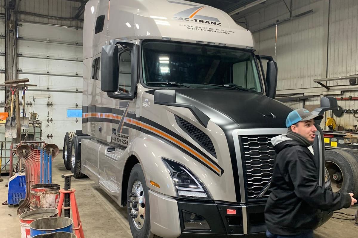 Professional Automotive Caucasian Mechanic Repair Semi Truck Diesel Engine Close Up.